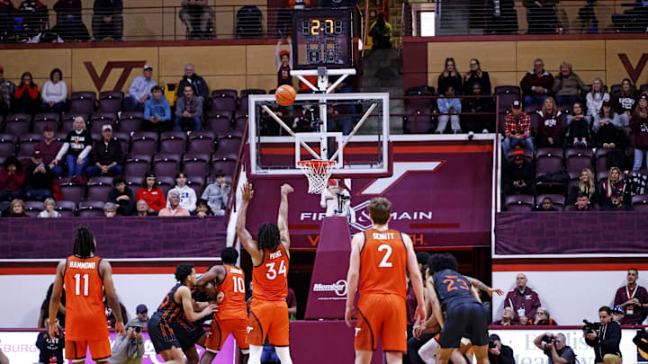 Jan 4, 2025; Blacksburg, Virginia, USA; Virginia Tech Hokies forward Mylyjael Poteat (34) shoots a free throw with 2.7 seconds left to win the game over the Miami Hurricanes at Cassell Coliseum. Mandatory Credit: Peter Casey-Imagn Images