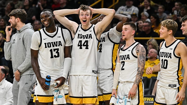 Dec 30, 2024; Iowa City, Iowa, USA; Iowa Hawkeyes forward Riley Mulvey (44) and Iowa Hawkeyes forward Ladji Dembele (13) and Iowa Hawkeyes guard Brock Harding (2) and Iowa Hawkeyes guard Jacob Koch (10) and the Hawkeyes bench react during the second half against the New Hampshire Wildcats at Carver-Hawkeye Arena. Mandatory Credit: Jeffrey Becker-Imagn Images