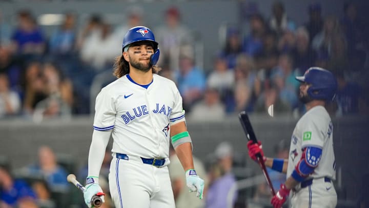 Jun 29, 2024; Toronto, Ontario, CAN; Toronto Blue Jays shortstop Bo Bichette (11) reacts to striking out against the New York Yankees at Rogers Centre. Mandatory Credit: Kevin Sousa-USA TODAY Sports