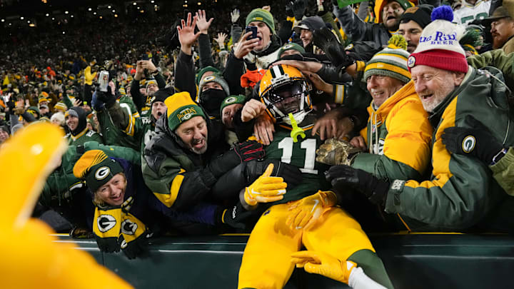 Green Bay Packers receiver Jayden Reed (11) celebrates after scoring a touchdown against the Miami Dolphins at Lambeau Field.