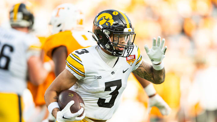 Jan 1, 2024; Orlando, FL, USA; Iowa Hawkeyes wide receiver Kaleb Brown (3) runs the ball against the Tennessee Volunteers in the fourth quarter at Camping World Stadium. Mandatory Credit: Jeremy Reper-Imagn Images