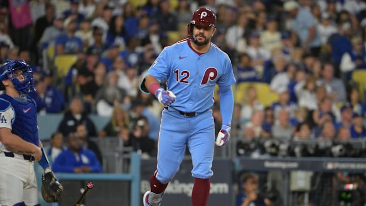 Oct 8, 2025; Los Angeles, California, USA; Philadelphia Phillies designated hitter Kyle Schwarber (12) flips his bat after hitting a solo home run during the fourth inning against the Los Angeles Dodgers in game three of the NLDS during the 2025 MLB playoffs at Dodger Stadium. Mandatory Credit: Jayne Kamin-Oncea-Imagn Images Oct 8, 2025; Los Angeles, California, USA; Philadelphia Phillies designated hitter Kyle Schwarber (12) flips his bat after hitting a solo home run during the fourth inning against the Los Angeles Dodgers in game three of the NLDS during the 2025 MLB playoffs at Dodger Stadium. Mandatory Credit: Jayne Kamin-Oncea-Imagn Images