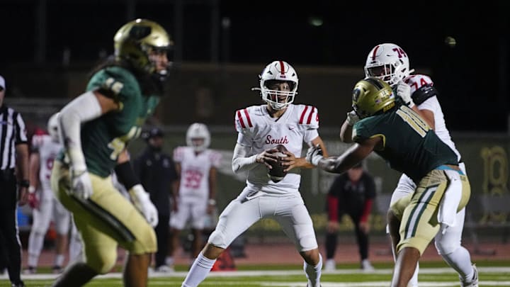 Millard South Jett Thomalla (4) looks for receivers against Basha during a game at Basha High School in Chandler on Aug. 30, 2024. Millard South Jett Thomalla (4) looks for receivers against Basha during a game at Basha High School in Chandler on Aug. 30, 2024.