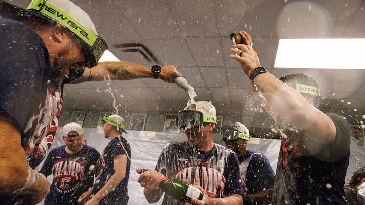 Sep 25, 2026; Kansas City, Missouri, USA;  Cleveland Guardians celebrate in the clubhouse after winning the AL central division championship at Kauffman Stadium.  Mandatory Credit: William Purnell-Imagn Images
