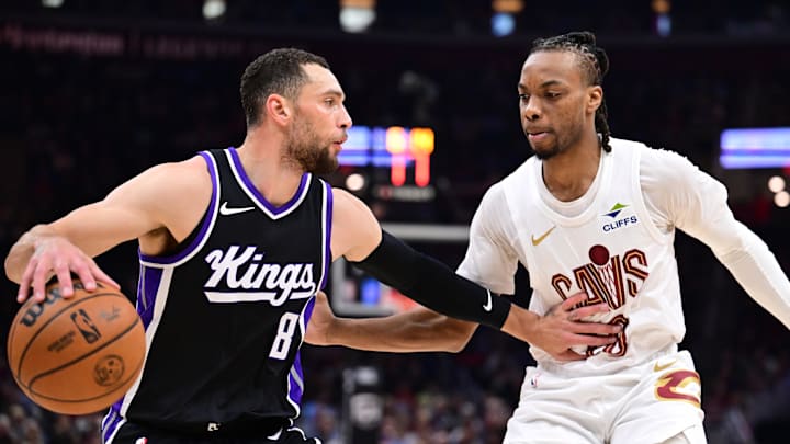 Apr 6, 2025; Cleveland, Ohio, USA; Sacramento Kings guard Zach LaVine (8) drives to the basket against Cleveland Cavaliers guard Darius Garland (10) during the first half at Rocket Arena. Mandatory Credit: Ken Blaze-Imagn Images