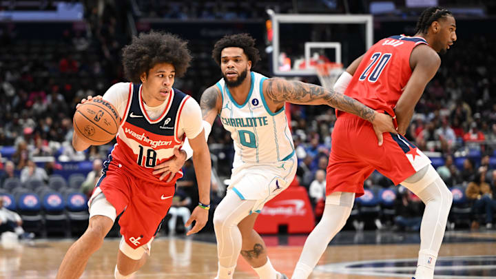 Oct 26, 2025; Washington, District of Columbia, USA; Washington Wizards forward Kyshawn George (18) drives past Charlotte Hornets forward Miles Bridges (0) during the first quarter at Capital One Arena. Mandatory Credit: Rafael Suanes-Imagn Images Oct 26, 2025; Washington, District of Columbia, USA; Washington Wizards forward Kyshawn George (18) drives past Charlotte Hornets forward Miles Bridges (0) during the first quarter at Capital One Arena. Mandatory Credit: Rafael Suanes-Imagn Images