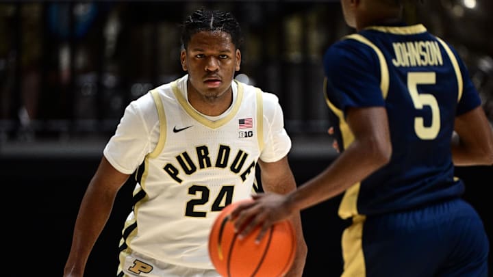 Purdue Boilermakers guard Gicarri Harris (24) closely watches Akron Zips guard Tavari Johnson (5).