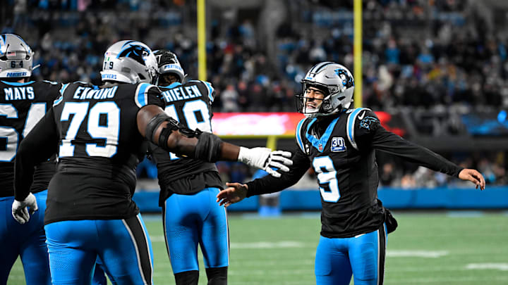 Dec 1, 2024; Charlotte, North Carolina, USA; Carolina Panthers quarterback Bryce Young (9) celebrates with offensive tackle Ikem Ekwonu (79) after the panthers score with 30 seconds left to take the lead in the fourth quarter at Bank of America Stadium. Mandatory Credit: Bob Donnan-Imagn Images