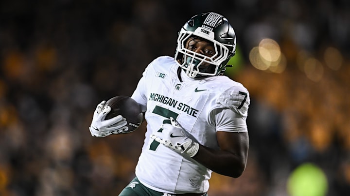 Nov 22, 2025; Iowa City, Iowa, USA; Michigan State Spartans running back Brandon Tullis (7) runs the ball against the Iowa Hawkeyes during the third quarter at Kinnick Stadium. Mandatory Credit: Jeffrey Becker-Imagn Images Nov 22, 2025; Iowa City, Iowa, USA; Michigan State Spartans running back Brandon Tullis (7) runs the ball against the Iowa Hawkeyes during the third quarter at Kinnick Stadium. Mandatory Credit: Jeffrey Becker-Imagn Images