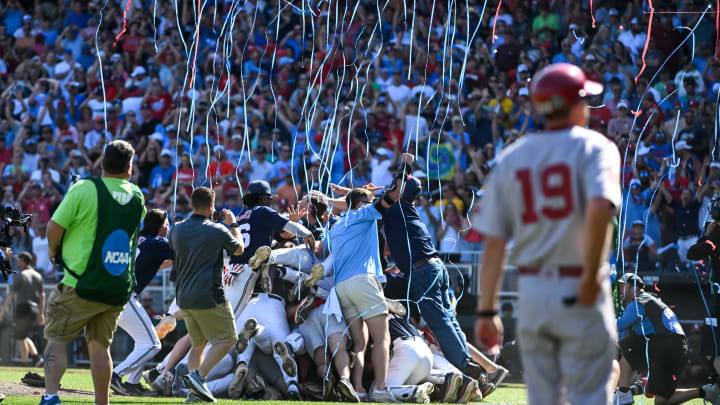 Jun 26, 2022; Omaha, NE, USA;  The Ole Miss Rebels celebrate winning the National Championship and the College World Series against the Oklahoma Sooners at Charles Schwab Field. Mandatory Credit: Steven Branscombe-USA TODAY Sports