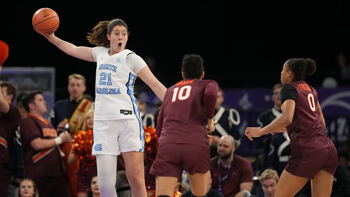 Mar 6, 2026; Duluth, GA, USA; North Carolina Tar Heels forward Ciera Toomey (21) controls a pass near Virginia Tech Hokies forward Carys Baker (10) during the first half at Gas South Arena. Mandatory Credit: Dale Zanine-Imagn Images
