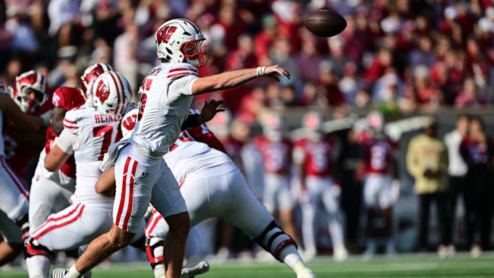 Nov 15, 2025; Bloomington, Indiana, USA; Wisconsin Badgers quarterback Carter Smith (5) passes the ball during the second half against the Indiana Hoosiers at Memorial Stadium. Mandatory Credit: Marc Lebryk-Imagn Images Nov 15, 2025; Bloomington, Indiana, USA; Wisconsin Badgers quarterback Carter Smith (5) passes the ball during the second half against the Indiana Hoosiers at Memorial Stadium. Mandatory Credit: Marc Lebryk-Imagn Images