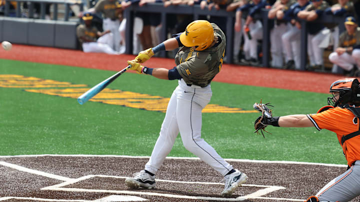 West Virginia freshman Spencer Barnett hammers a two-RBI double in the second inning versus Oklahoma State.