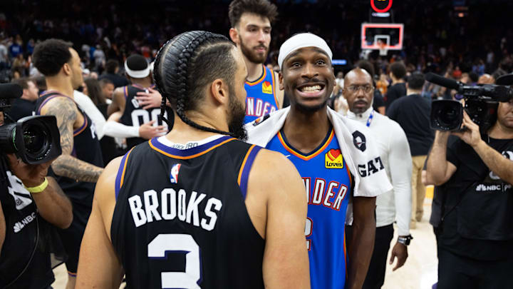 Apr 27, 2026; Phoenix, Arizona, USA; Oklahoma City Thunder guard Shai Gilgeous-Alexander (2) greets Phoenix Suns forward Dillon Brooks (3) after advancing in a four game sweep of the first round of the 2026 NBA Playoffs at Mortgage Matchup Center. Mandatory Credit: Mark J. Rebilas-Imagn Images