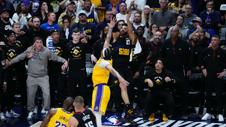 Apr 22, 2024; Denver, Colorado, USA; Denver Nuggets guard Jamal Murray (27) shoots over Los Angeles