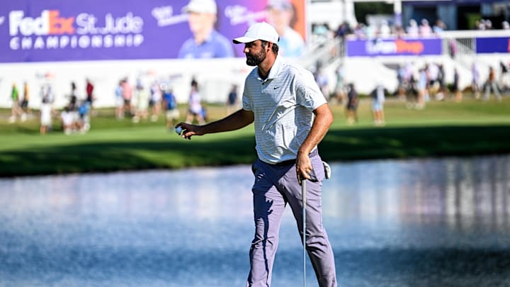 Aug 17, 2024; Memphis, Tennessee, USA; Scottie Scheffler  waves to the crowd on 18 after his round during the third round of the FedEx St. Jude Championship golf tournament at TPC Southwind. Mandatory Credit: Steve Roberts-Imagn Images