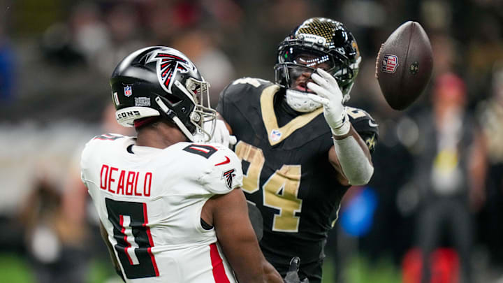 Nov 23, 2025; New Orleans, Louisiana, USA; Atlanta Falcons linebacker Divine Deablo (0) breaks up the pass to New Orleans Saints running back Devin Neal (24) during the second half at Caesars Superdome. Mandatory Credit: Matthew Hinton-Imagn Images Nov 23, 2025; New Orleans, Louisiana, USA; Atlanta Falcons linebacker Divine Deablo (0) breaks up the pass to New Orleans Saints running back Devin Neal (24) during the second half at Caesars Superdome. Mandatory Credit: Matthew Hinton-Imagn Images