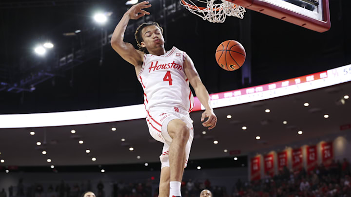 Dec 29, 2025; Houston, Texas, USA; Houston Cougars guard Kingston Flemings (4) dunks the ball during the second half against the Middle Tennessee Blue Raiders at Fertitta Center. Mandatory Credit: Troy Taormina-Imagn Images