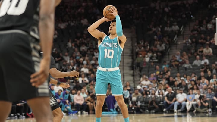 Mar 14, 2025; San Antonio, Texas, USA; Charlotte Hornets guard Josh Green (10) shoots during the first half against the San Antonio Spurs at Frost Bank Center. Mandatory Credit: Scott Wachter-Imagn Images