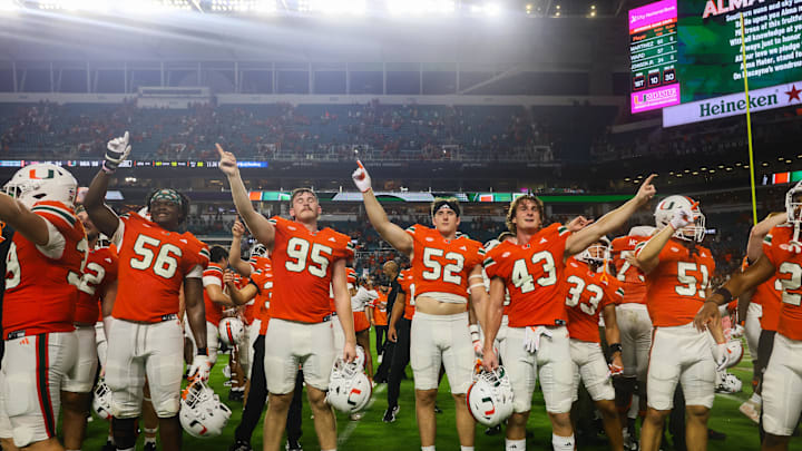 Sep 27, 2024; Miami Gardens, Florida, USA;  Miami Hurricanes players celebrate after the game against the Virginia Tech Hokies at Hard Rock Stadium. Mandatory Credit: Sam Navarro-Imagn Images