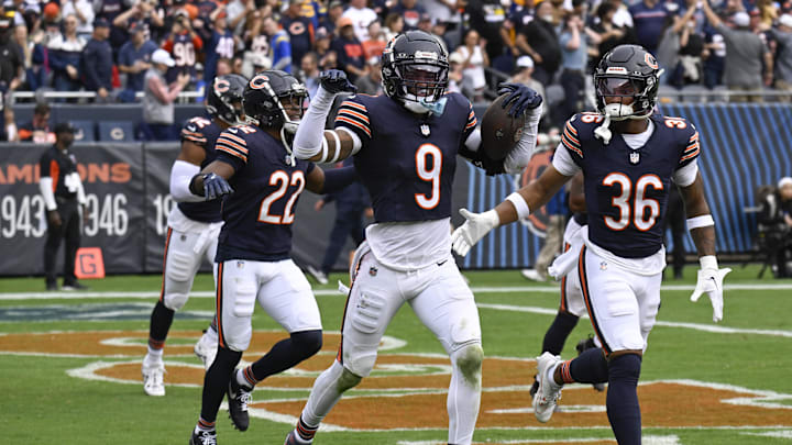 Sep 29, 2024; Chicago, Illinois, USA;  Chicago Bears safety Jaquan Brisker (9) celebrates with teammates after intercepting a pass at the end of the second half at Soldier Field. Mandatory Credit: Matt Marton-Imagn Images