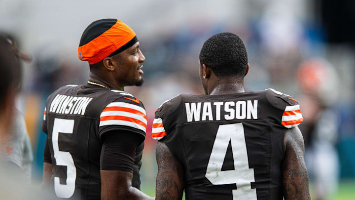 Sep 15, 2024; Jacksonville, Florida, USA; Cleveland Browns quarterback Jameis Winston (5) talks with quarterback Deshaun Watson (4) in the fourth quarter at EverBank Stadium. Mandatory Credit: Jeremy Reper-Imagn Images