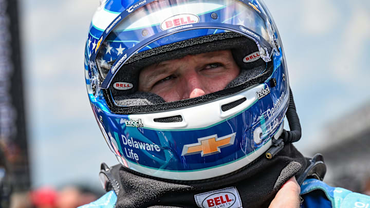 NASCAR Cup Series driver Michael McDowell (71) puts on his helmet Saturday, July 26, 2025, during qualifying for the Brickyard 400 at Indianapolis Motor Speedway.
