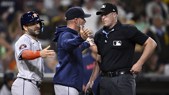 Houston Astros manager Joe Espada and second baseman Jose Altuve converse with home plate umpire Brennan Miller during the ninth inning of Tuesday's win over the San Diego Padres. Houston Astros manager Joe Espada and second baseman Jose Altuve converse with home plate umpire Brennan Miller during the ninth inning of Tuesday's win over the San Diego Padres.