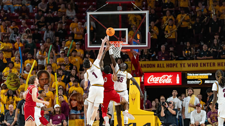 Arizona State Sun Devils Santiago Trouet (1) and Massamba Diop (35) attempt to block Southern Utah Thunderbirds Isaiah Cottrell (0) during a game at Desert Financial Arena in Tempe on Nov. 4, 2025.