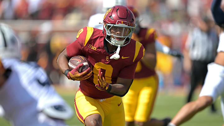Oct 12, 2024; Los Angeles, California, USA; USC Trojans running back Quinten Joyner (0) takes a pass form quarterback Miller Moss (7) into the end zone for a touchdown in the first half against the Penn State Nittany Lions United Airlines Field at Los Angeles Memorial Coliseum. Mandatory Credit: Jayne Kamin-Oncea-Imagn Images Oct 12, 2024; Los Angeles, California, USA; USC Trojans running back Quinten Joyner (0) takes a pass form quarterback Miller Moss (7) into the end zone for a touchdown in the first half against the Penn State Nittany Lions United Airlines Field at Los Angeles Memorial Coliseum. Mandatory Credit: Jayne Kamin-Oncea-Imagn Images