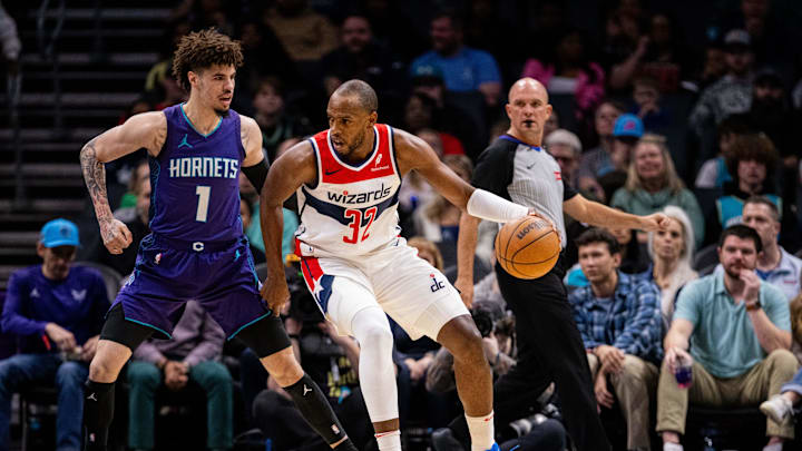 Mar 1, 2025; Charlotte, North Carolina, USA; Washington Wizards forward Khris Middleton (32) backs down Charlotte Hornets guard LaMelo Ball (1) during the first quarter at Spectrum Center. Mandatory Credit: Scott Kinser-Imagn Images Mar 1, 2025; Charlotte, North Carolina, USA; Washington Wizards forward Khris Middleton (32) backs down Charlotte Hornets guard LaMelo Ball (1) during the first quarter at Spectrum Center. Mandatory Credit: Scott Kinser-Imagn Images