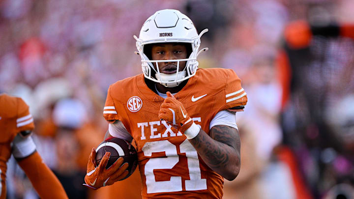 Texas Longhorns wide receiver Ryan Niblett returns a punt for touchdown against the Oklahoma Sooners during the second half at the Cotton Bowl.