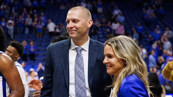 Nov 4, 2024; Lexington, Kentucky, USA; Kentucky Wildcats head coach Mark Pope walks off the court with his wife Lee Anne after the game against the Wright State Raiders at Rupp Arena at Central Bank Center. Mandatory Credit: Jordan Prather-Imagn Images