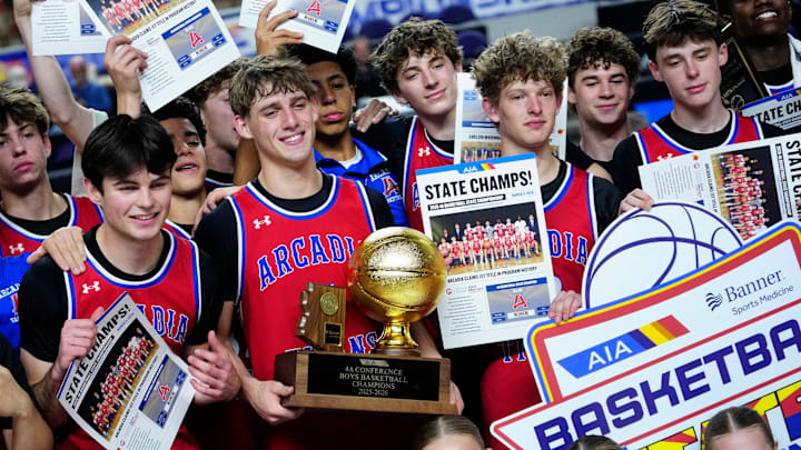 Arcadia guard Mason Kendrick (5) holds the trophy with his teammates after they beat Deer Valley in the 4A boys state championship game at Arizona Veterans Memorial Coliseum in Phoenix on March 5, 2026.