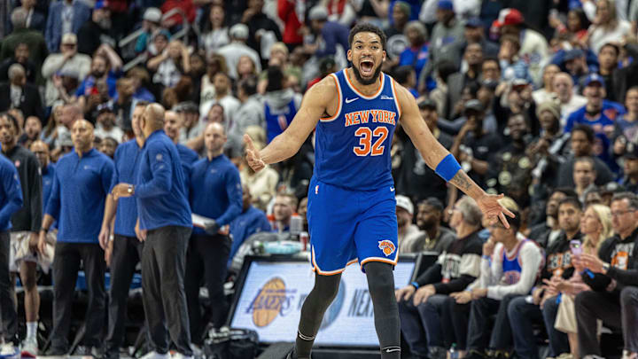 Apr 27, 2025; Detroit, Michigan, USA; New York Knicks center Karl-Anthony Towns (32) hits a three point basket late in the fourth quarter of game four of first round for the 2025 NBA Playoffs  against the Detroit Pistons at Little Caesars Arena. Mandatory Credit: David Reginek-Imagn Images