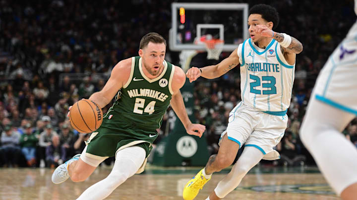 Feb 27, 2024; Milwaukee, Wisconsin, USA; Milwaukee Bucks guard Pat Connaughton (24) drives for the basket against Charlotte Hornets guard Tre Mann (23) in the fourth quarter at Fiserv Forum. Mandatory Credit: Benny Sieu-Imagn Images Feb 27, 2024; Milwaukee, Wisconsin, USA; Milwaukee Bucks guard Pat Connaughton (24) drives for the basket against Charlotte Hornets guard Tre Mann (23) in the fourth quarter at Fiserv Forum. Mandatory Credit: Benny Sieu-Imagn Images