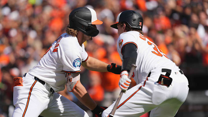 Sep 2, 2024; Baltimore, Maryland, USA; Baltimore Orioles shortstop Gunnar Henderson (left) is greeted after his first inning solo home run by catcher Adley Rutschman (right) against the Chicago White Sox at Oriole Park at Camden Yards.