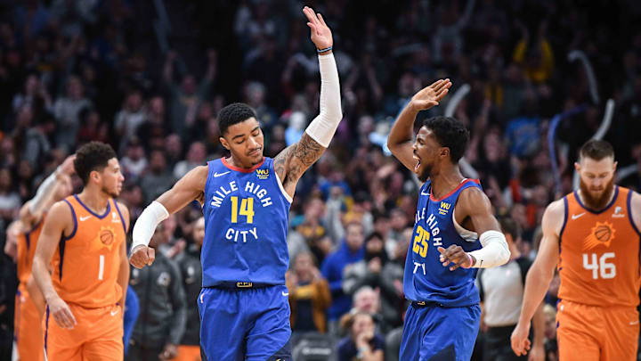 Oct 25, 2019; Denver, CO, USA; Denver Nuggets guard Gary Harris (14) and guard Malik Beasley (25) high five while playing the Phoenix Suns during the second half at Pepsi Center. Mandatory Credit: Michael Ciaglo-Imagn Images