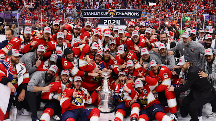 Jun 24, 2024; Sunrise, Florida, USA; The Florida Panthers pose with the cup for a team photo after winning game seven of the 2024 Stanley Cup Final against the Edmonton Oilers at Amerant Bank Arena. Mandatory Credit: Sam Navarro-Imagn Images