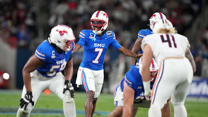 Jan 2, 2026; San Diego, CA, USA; SMU Mustangs quarterback Kevin Jennings (7) prepares to take the snap against the Arizona Wildcats in the first half during the Holiday Bowl at Snapdragon Stadium. Mandatory Credit: Kirby Lee-Imagn Images