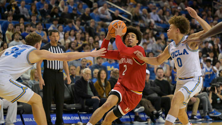 Jan 10, 2026; Los Angeles, California, USA;  Maryland Terrapins guard Myles Rice (2) is defended by UCLA Bruins forward Tyler Bilodeau (34) and guard Trent Perry (0) as he drives to the basket in the first half at Pauley Pavilion presented by Wescom Financial. Mandatory Credit: Jayne Kamin-Oncea-Imagn Images