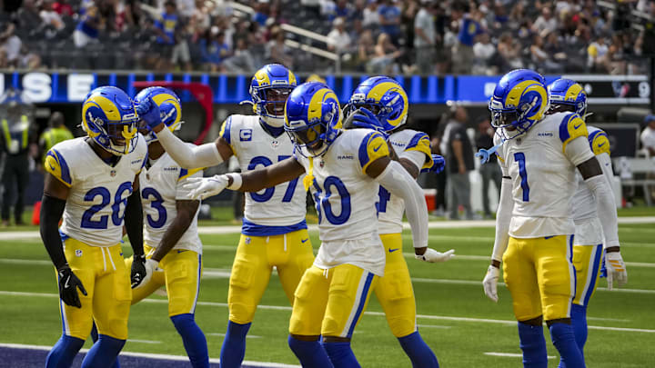 Sep 7, 2025; Inglewood, California, USA; Los Angeles Rams cornerback Cobie Durant (14) celebrates after intercepting a pass during the fourth quarter at SoFi Stadium. Mandatory Credit: Kirby Lee-Imagn Images