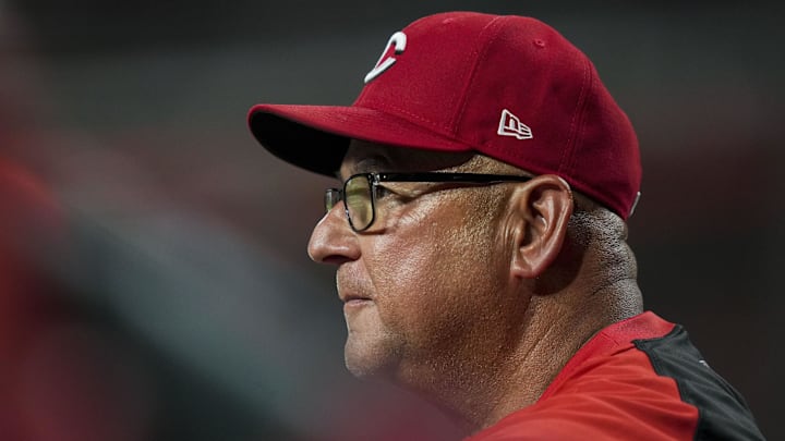 Jul 29, 2025; Cincinnati, Ohio, USA;  Cincinnati Reds manager Terry Francona (77) watches from the dugout during the game against the Los Angeles Dodgers in the eighth inning at Great American Ball Park. Mandatory Credit: Aaron Doster-Imagn Images