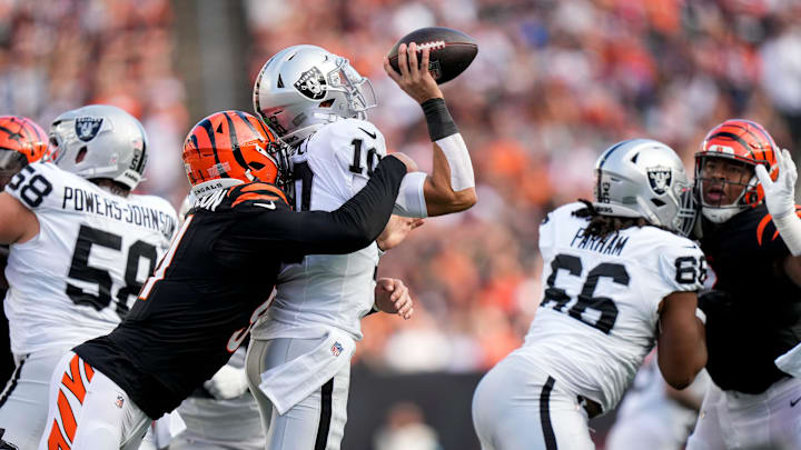 Cincinnati Bengals defensive end Trey Hendrickson (91) sacks Las Vegas Raiders quarterback Desmond Ridder (10) in the third quarter of the NFL Week 9 game between the Cincinnati Bengals and the Las Vegas Raiders at Paycor Stadium in downtown Cincinnati on Sunday, Nov. 3, 2024. The Bengals collected their first win at home with a 41-24 victory over the Raiders.