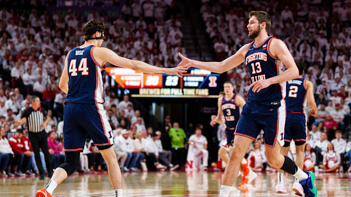 Feb 1, 2026; Lincoln, Nebraska, USA; Illinois Fighting Illini center Tomislav Ivisic (13) and center Zvonimir Ivisic (44) celebrate after a shot in the first half against the Nebraska Cornhuskers at Pinnacle Bank Arena. Mandatory Credit: Dylan Widger-Imagn Images