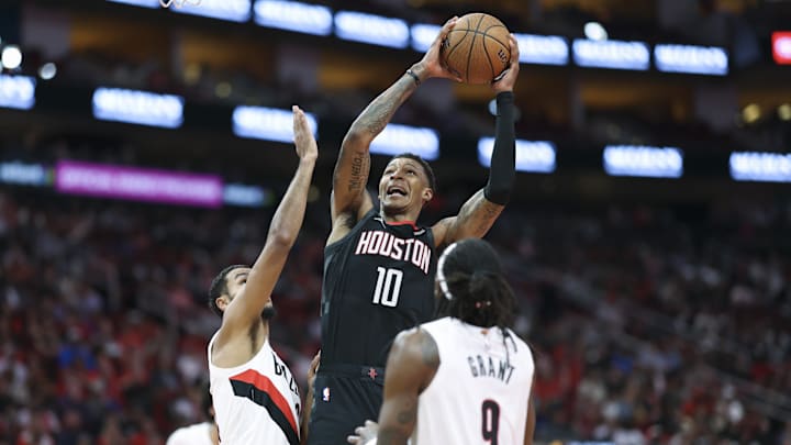Nov 14, 2025; Houston, Texas, USA;  Houston Rockets forward Jabari Smith Jr. (10) attempts to score as Portland Trail Blazers forward Kris Murray (24) defends during the second quarter at Toyota Center. Mandatory Credit: Troy Taormina-Imagn Images