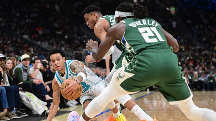 Feb 27, 2024; Milwaukee, Wisconsin, USA;  Charlotte Hornets guard Tre Mann (23) reaches for a loose