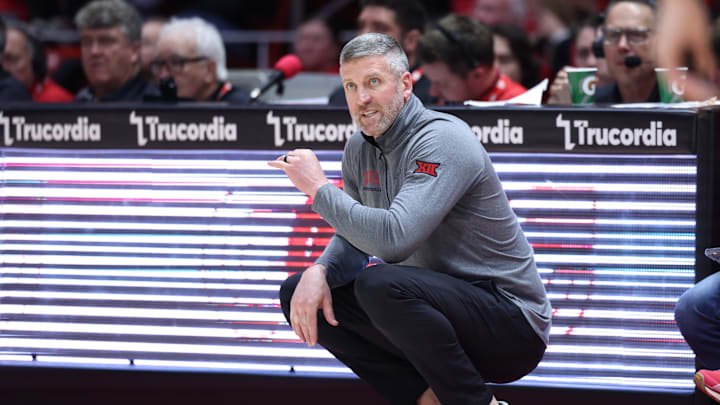 Mar 4, 2025; Salt Lake City, Utah, USA; Utah Utes guard head coach Josh Eilert looks on against the West Virginia Mountaineers during the first half at Jon M. Huntsman Center. Mandatory Credit: Rob Gray-Imagn Images Mar 4, 2025; Salt Lake City, Utah, USA; Utah Utes guard head coach Josh Eilert looks on against the West Virginia Mountaineers during the first half at Jon M. Huntsman Center. Mandatory Credit: Rob Gray-Imagn Images