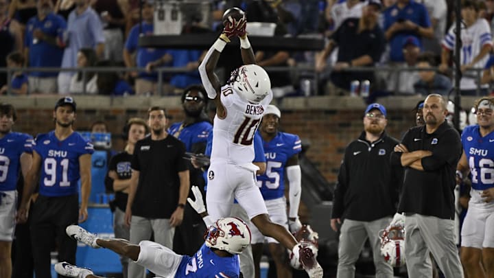 Sep 28, 2024; Dallas, Texas, USA; Florida State Seminoles wide receiver Malik Benson (10) and Southern Methodist Mustangs cornerback Deuce Harmon (7) in action during the game between the Southern Methodist Mustangs and the Florida State Seminoles at Gerald J. Ford Stadium. Mandatory Credit: Jerome Miron-Imagn Images