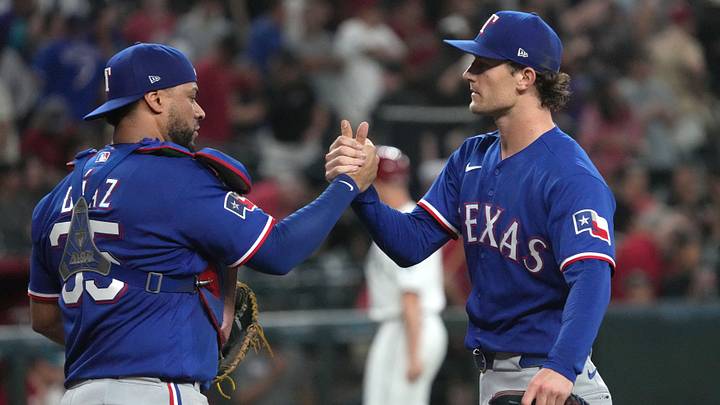 Sep 13, 2026; Phoenix, Arizona, USA;  Texas Rangers pitcher Jacob Latz (67) and catcher Elias Diaz (35) celebrate after defeating the Arizona Diamondbacks in the ninth inning at Chase Field.  Mandatory Credit: Rick Scuteri-Imagn Images
